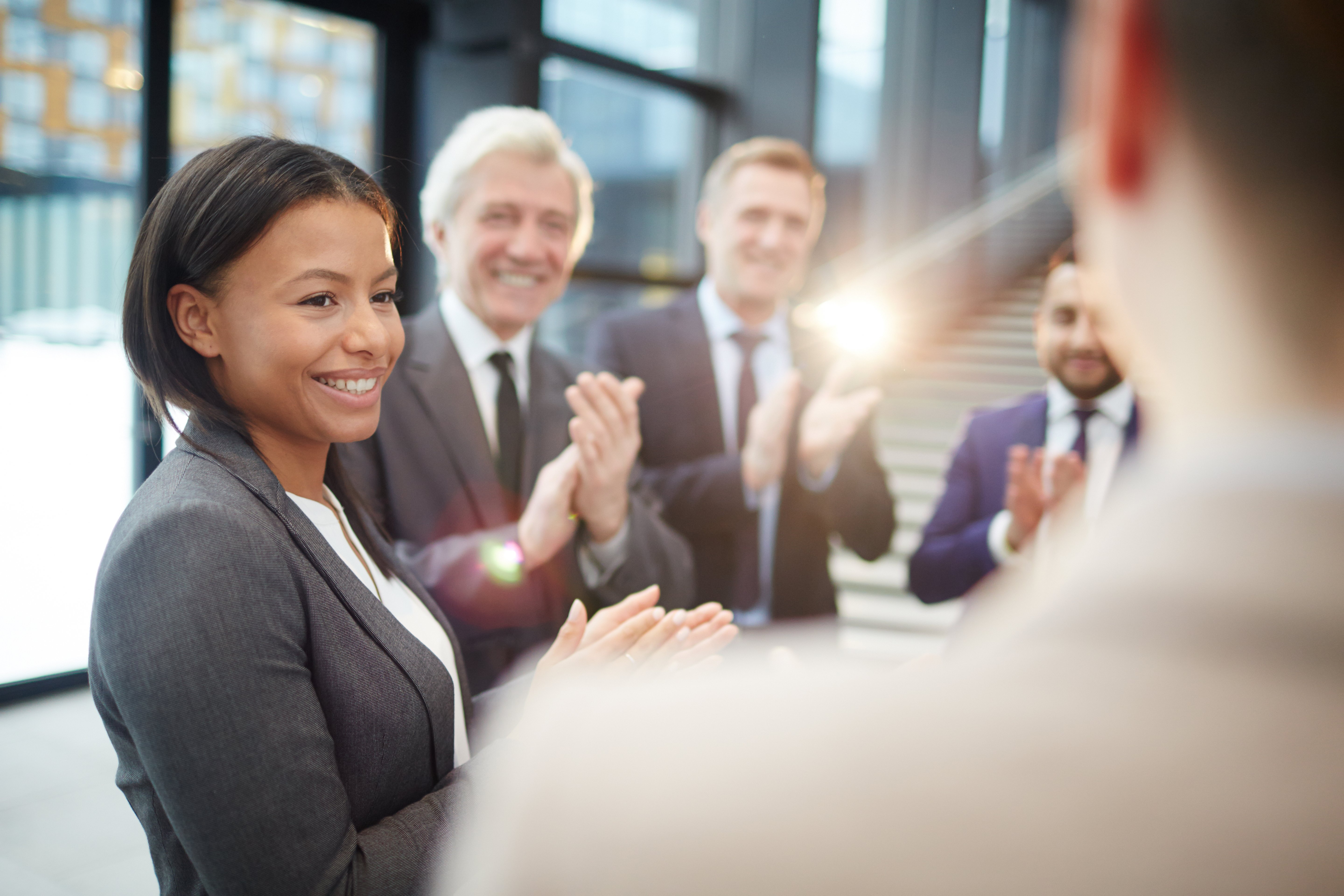public-sector-group-of-coworkers-suits-smiling-clapping.jpg