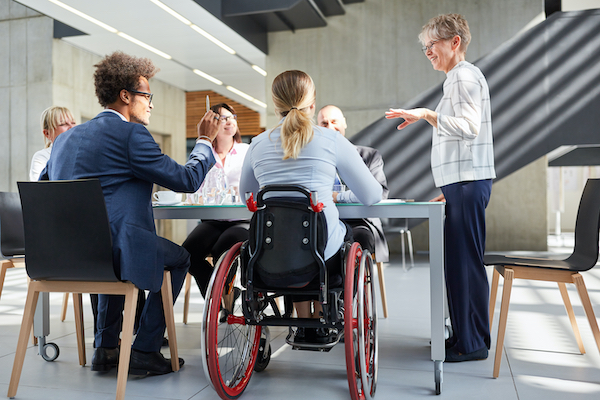 ES_Header-600x400-dei-coworkers-wheelchair-diverse-meeting 2