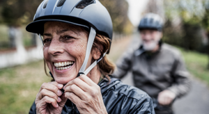 ES_Thumb-300x164-older-woman-husband-biking-active-helmet-outside-physical-activity